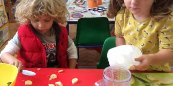 Chopping fruit and pouring milk